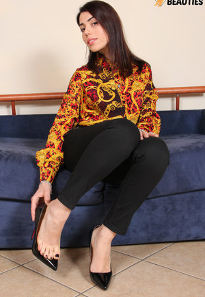 18 year old girl Katie Lewis stands naked after undressing in her bedroom